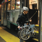 Person getting on the T with bike