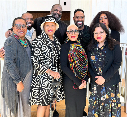 A group of eight attendees to the 40th Annual NAACP Cambridge Branch MLK Brunch event pose for a photo
