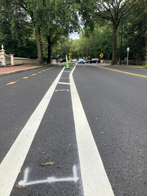Markings show where concrete curbs will go on Brattle Street.