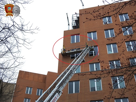 Ladder 2 with the aerial ladder deployed to high-rise building with construction workers trapped in a disabled scaffolding -  Mar302026