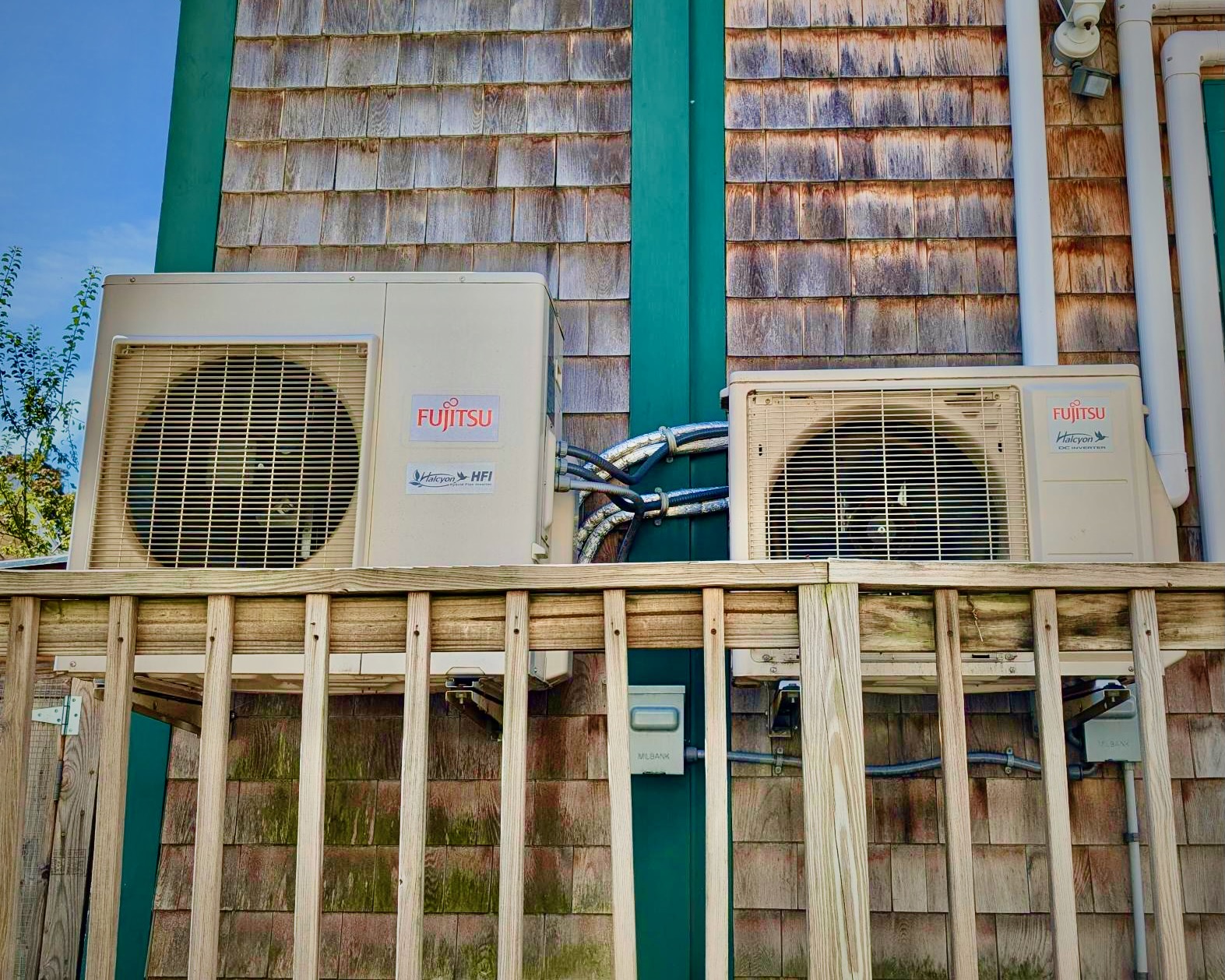 A photograph of heat pump equipment outside a Cambridge home. 