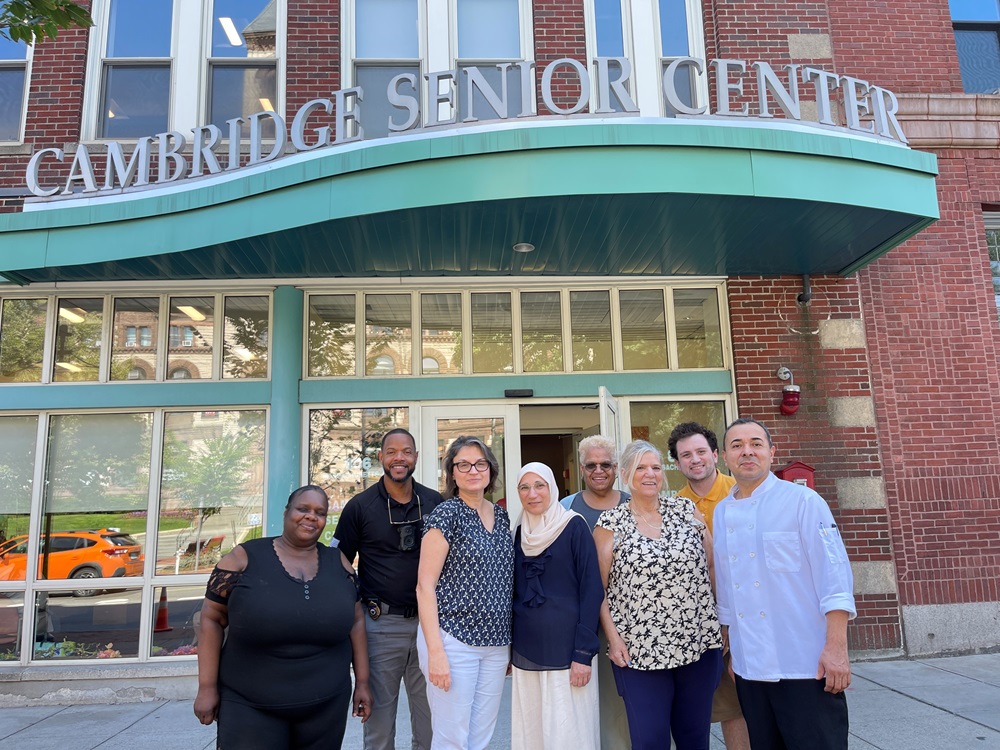 Council on Aging Staff stand in front of the Cambridge Senior Center