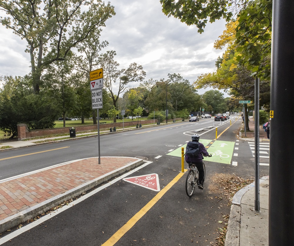 A bicyclist travels on a dedicated bicycle lane.