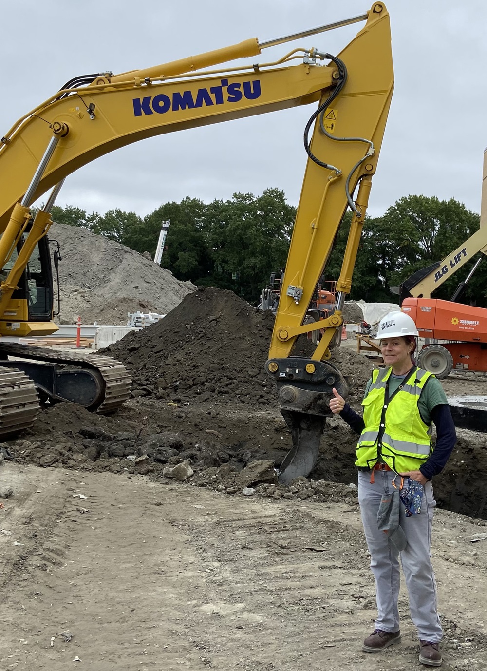 Public Works’ Environmental Engineer Diane Stokes stands in front of a construction site and one of her many projects.