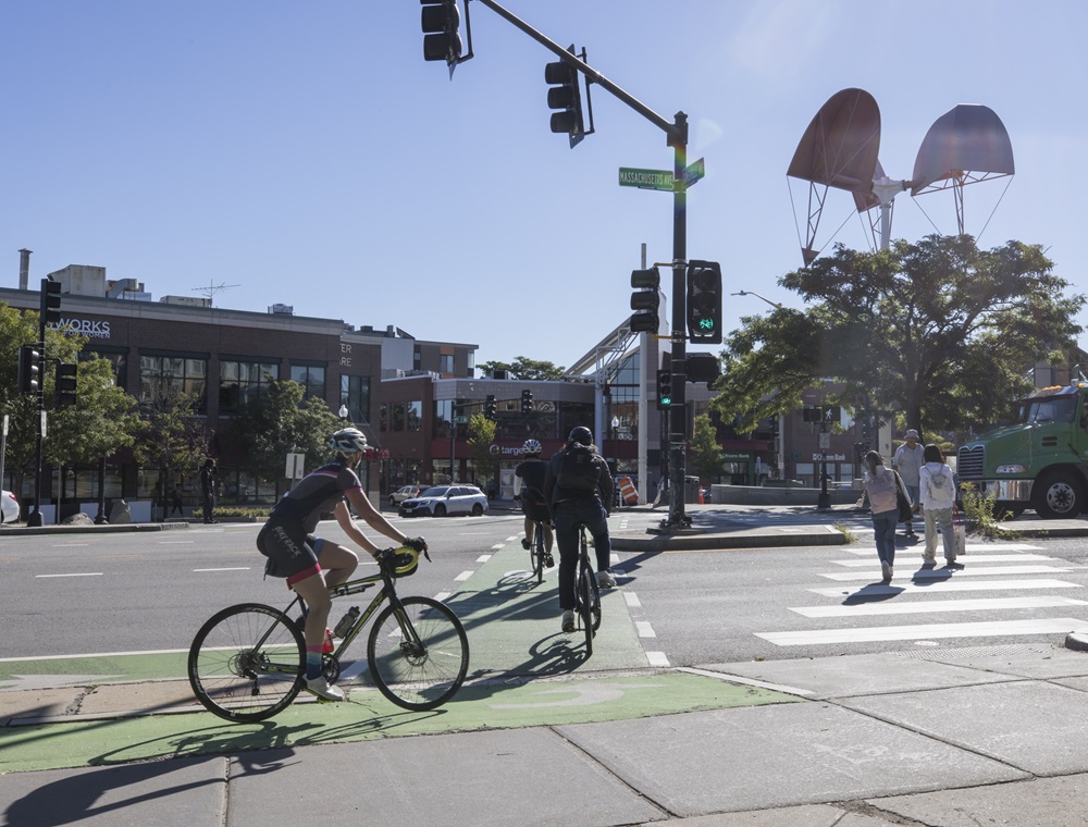 Bikers and pedestrians travel in Porter Square