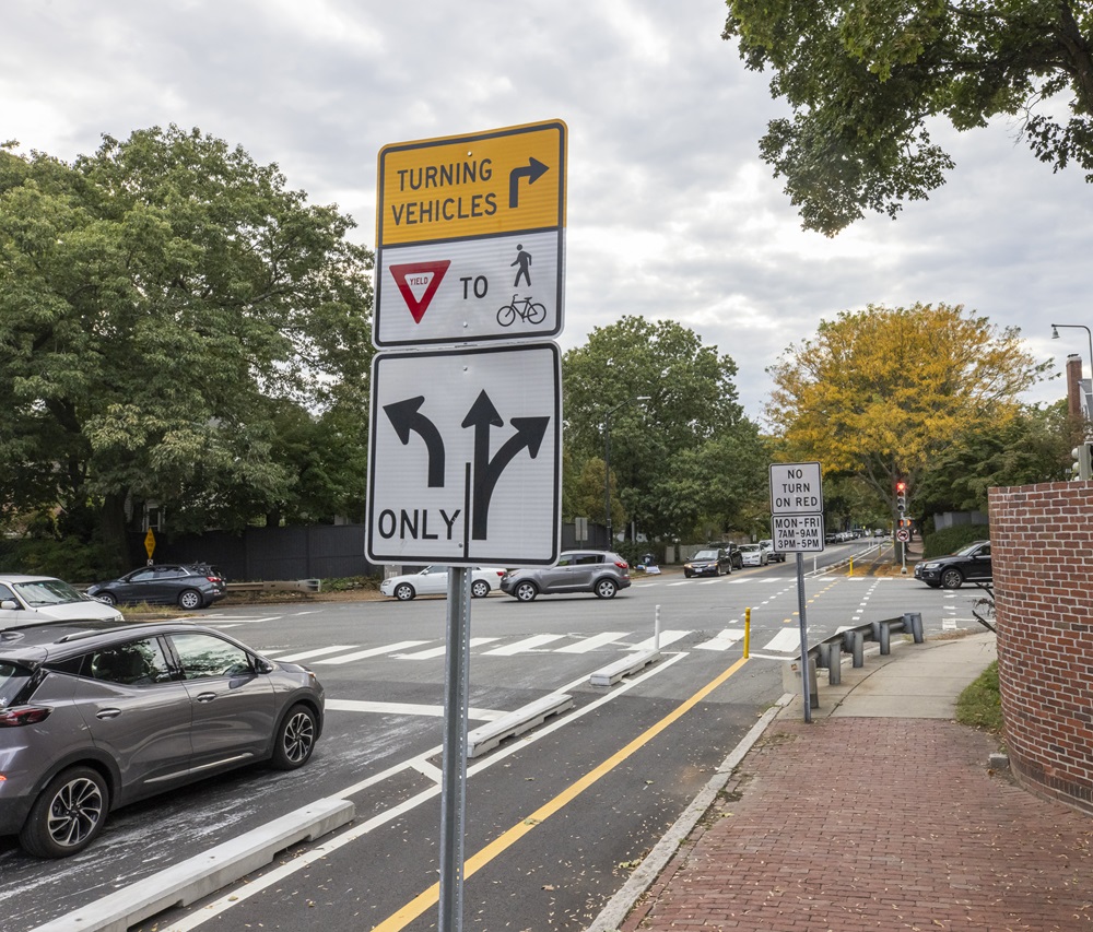 Street signs direct turning vehicles and others in Cambridge