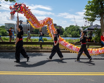 Gund Kwok performs their dragon dance in the Mermaid Promenade at the 2024 Cambridge Arts River Festival. (Luis Cotto photo)