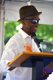 Jean Dany Joachim hosts the Poetry Stage at the 2024 Cambridge Arts River Festival. (Greg Cook photo)