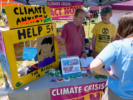 Extinction Rebellion at the Community Tables at the 2024 Cambridge Arts River Festival. (Greg Cook photo)