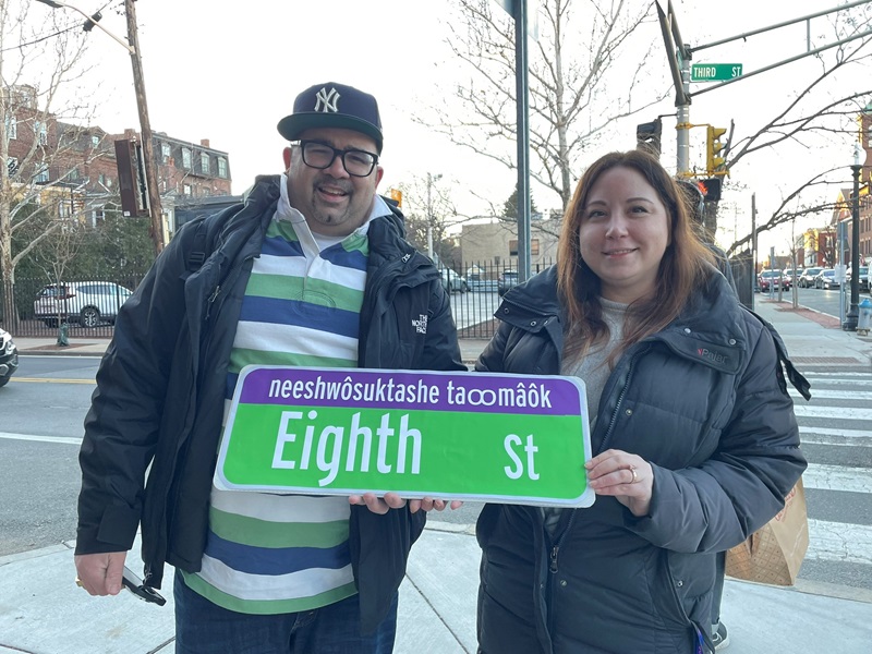 David Shane Lowry and Sage Carbone present a mockup of the new bilingual street sign for Eighth Street