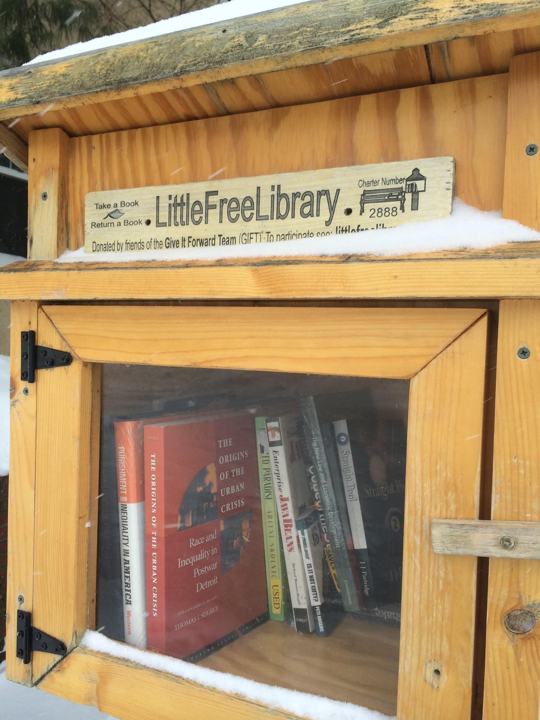 Very close up shot of Little Free Library showing available books inside