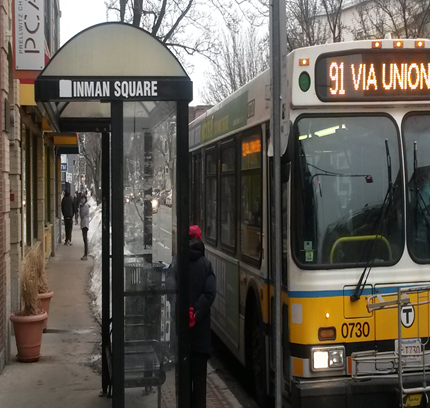 Bus at stop with passenger wiating to board