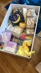 Baby box with baby supplies for a new parent household