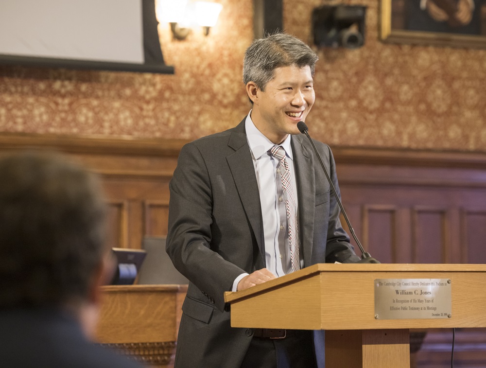 City Manager Yi-An Huang speaks at a podium.